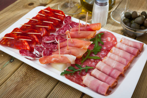 istock Spanish sausage sliced - chorizo, fuet, jamon, salami, bacon 1150321170