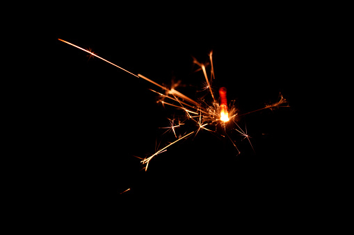 actual photograph of fire flames in a row on black background.