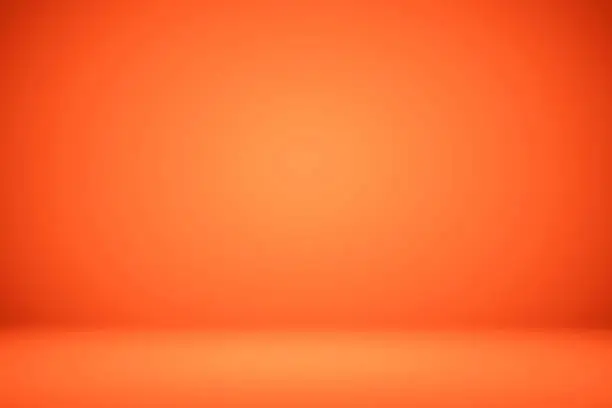 Photo of Empty orange studio room, used as background for display your products