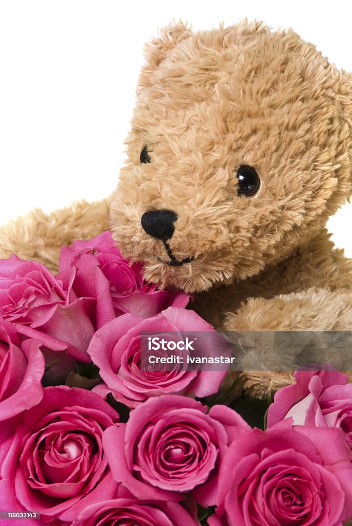 Ours en peluche avec un visage heureux souriant tenant des Roses - Photo de Ours en peluche libre de droits