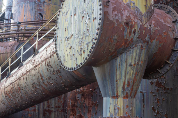 istock Huge rusting pipes with catwalks, steel mill industrial complex 1150322862