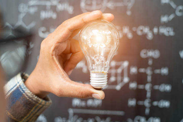 istock A hand holding is light bulb, Creative ideas concept, lightbulb for new idea, object design for thinking - Image - Image 1150324254