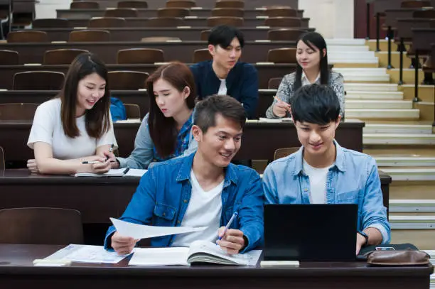 Photo of Students having class in university auditorium