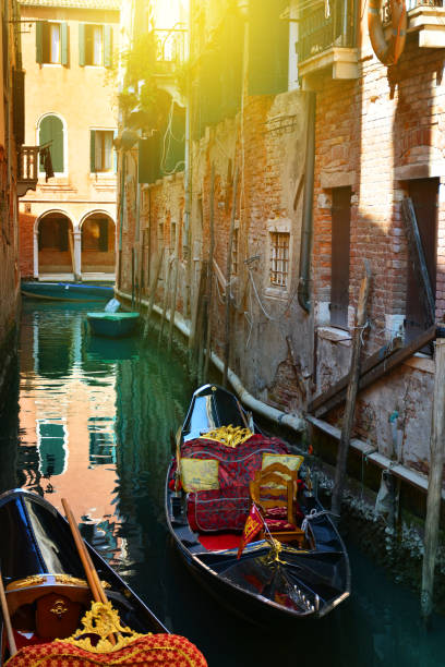 istock Venice, Italy. Gondolas in a romantic narrow canal 1150330623
