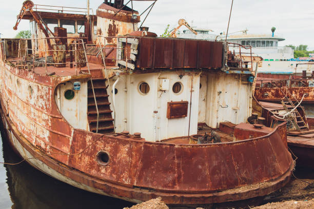 istock Old abandoned ship on the river bank. 1150334088