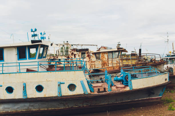 istock Old abandoned ship on the river bank. 1150334098