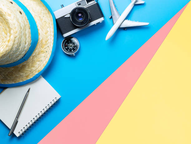 istock Travel accessories objects and gadgets top view flatlay on blue yellow pink 1150339639
