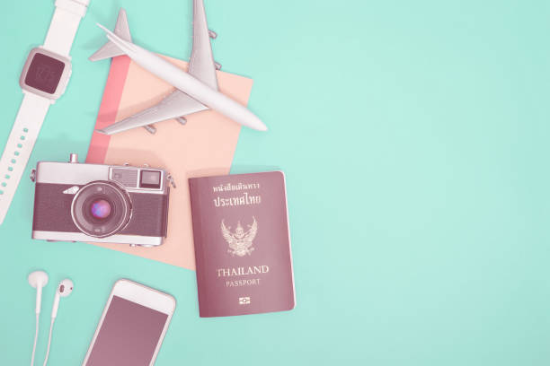 istock Hi tech travel gadget and accessories on blue teal copy space flat lay top view 1150339744