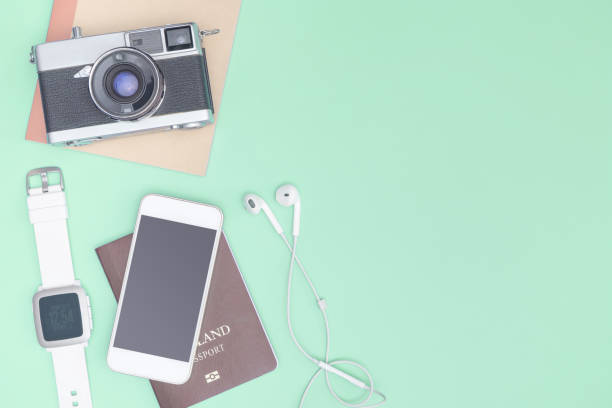 istock Travel accessories objects and gadgets top view flatlay on blue pastel 1150339752