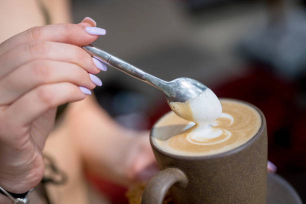 Hands holding a cup of coffee in cafe, Nikon Z7
