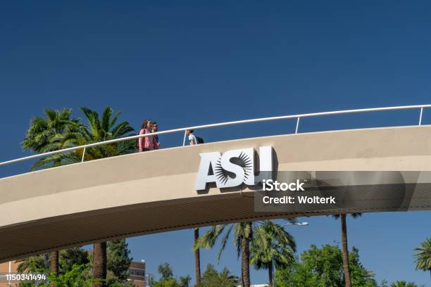 Unidentified Individuals Passing Overhead Bridge At Arizona State University Stock Photo - Download Image Now