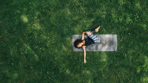 istock Woman doing Yoga in the Park 1150342464