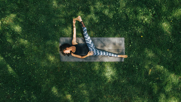 istock Woman doing Yoga in the Park 1150342473