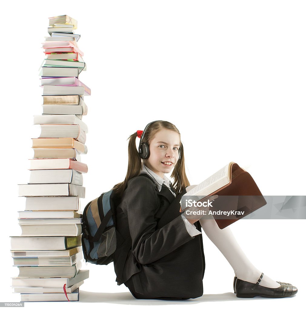 Teen girl sitting at a stack of books Activity Stock Photo Teen girl sitting at a stack of books Activity Stock Photo