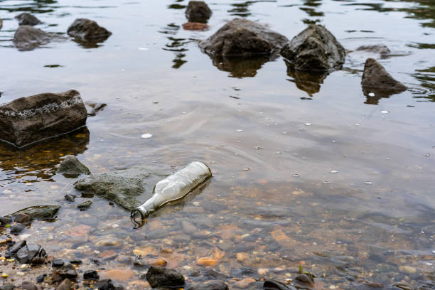istock A clear bottle lies in the river as litter polluting the environment. 1150342914