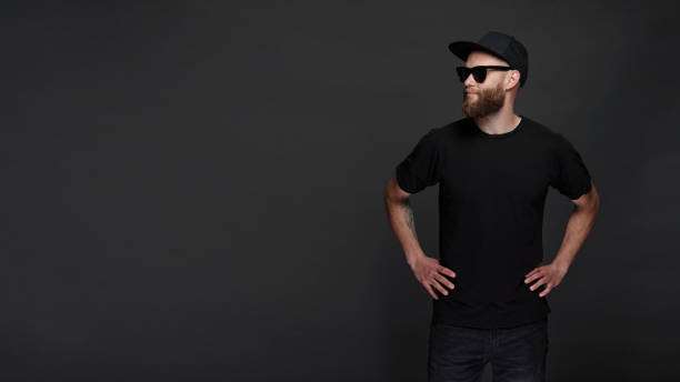 istock Hipster handsome male model with beard wearing black blank baseball cap with space for your logo 1150343508