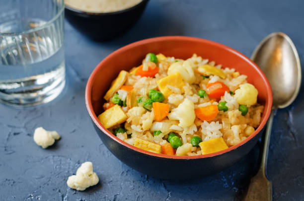 istock Cauliflower green peas rice with fresh cauliflower slices 1150343841