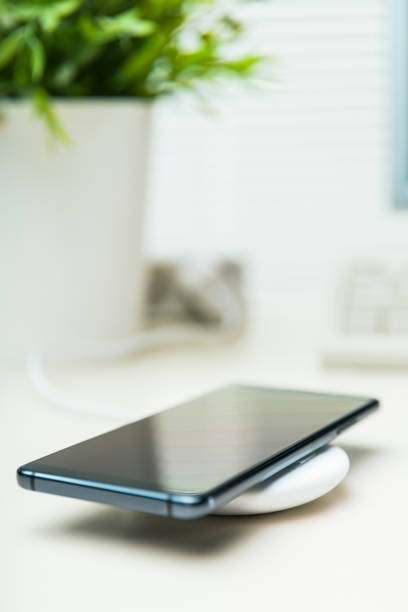istock Mobile phone on wireless charger 1150344114