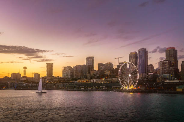 Beautiful Seattle waterfront skyline from Elliott Bay at dusk. Dreamy cityscape or scenery. Washington state, USA. Beautiful Seattle waterfront skyline from Elliott Bay at dusk. Dreamy cityscape or scenery. Washington state, USA. puget sound stock pictures, royalty-free photos & images