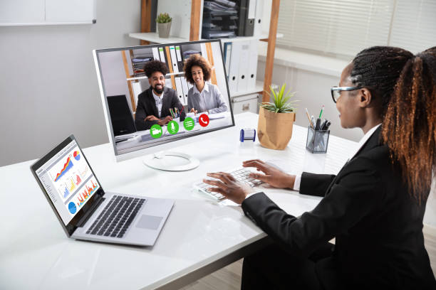 istock Happy Businesswoman Videoconferencing With Her Colleagues 1150345168