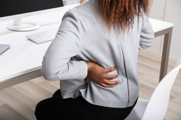 istock Businesswoman Suffering From Backache While Working In Office 1150345172
