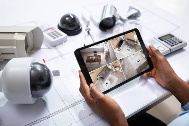 istock Person Watching Footage On Tablet With Security Equipment 1150345371
