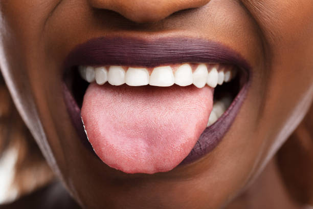istock Woman Showing Tongue 1150345629