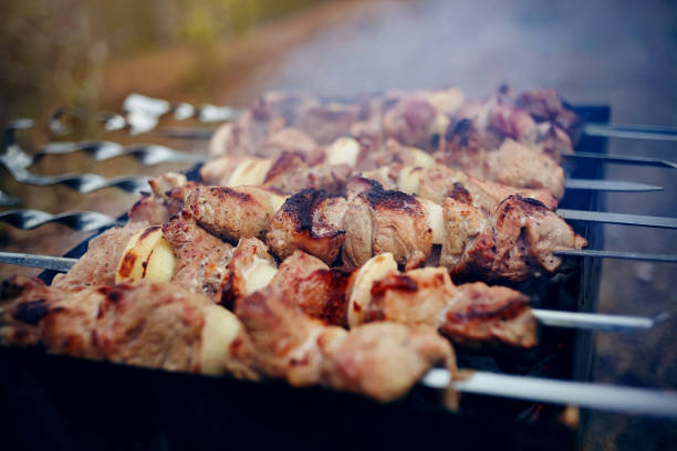 istock Smoky grilling the marinated pork meat shashlik. 1150346820