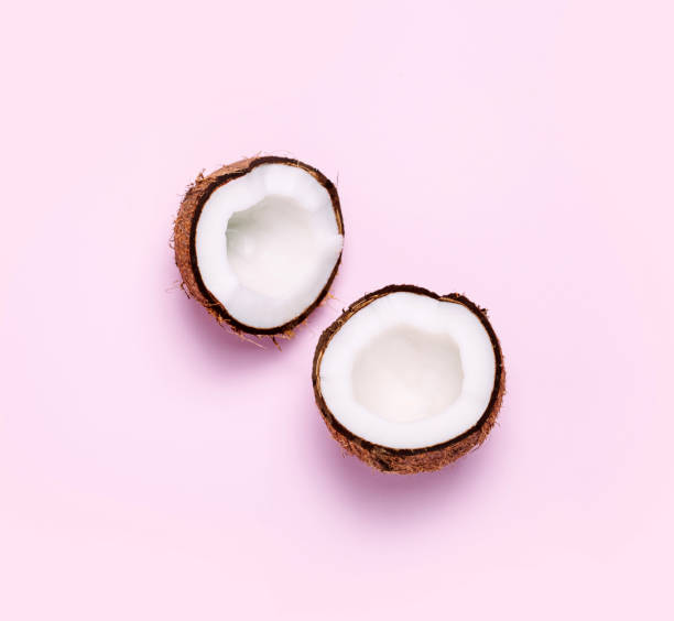 istock Coconut on pink background. Minimal concept. 1150348189