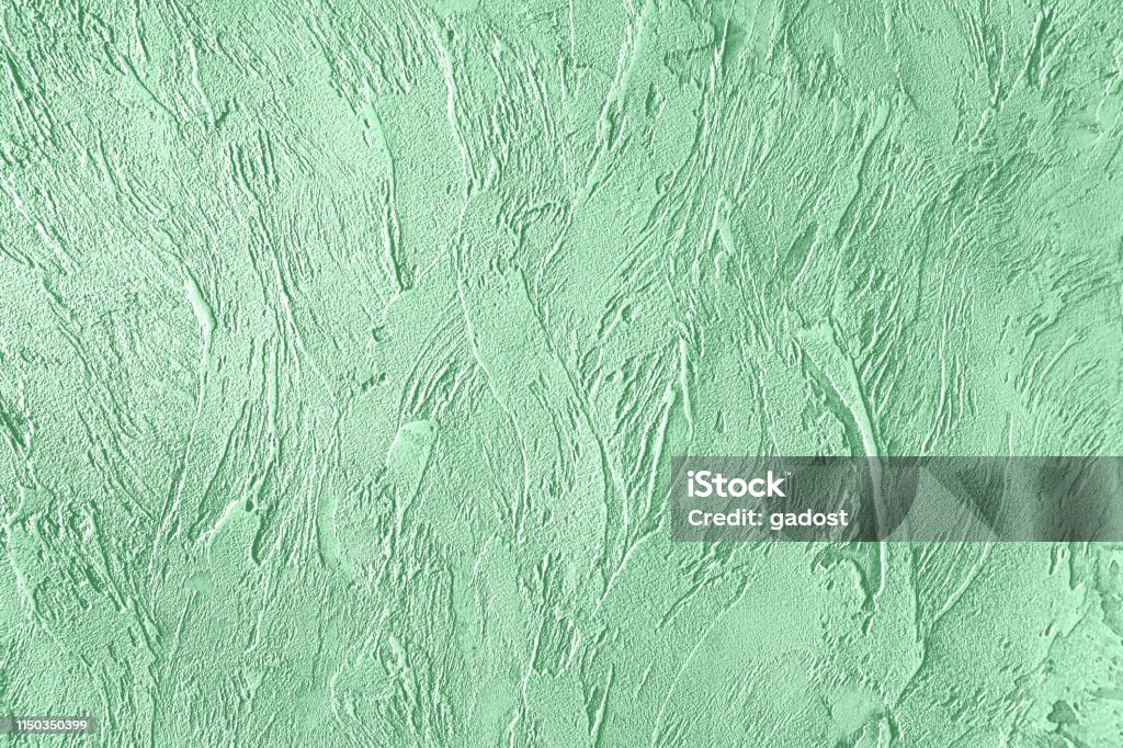 Mint colored Concrete textured background Trendy mint colored rouge concrete textured background for concept or product. Toned image. Abstract Stock Photo