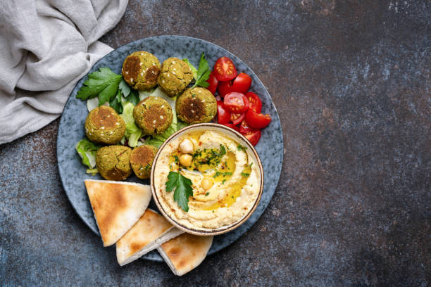 Chickpea hummus with falafel and pita bread Chickpea hummus with falafel and pita bread. Vegan, vegetarian arabian food. Top view, Copy space hummus stock pictures, royalty-free photos & images