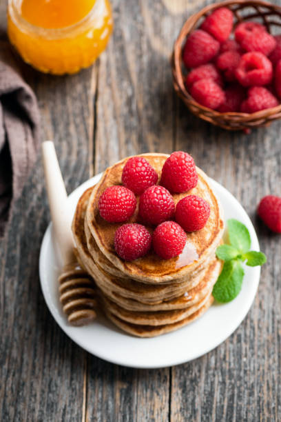 istock Tasty oat pancakes with raspberries 1150350541