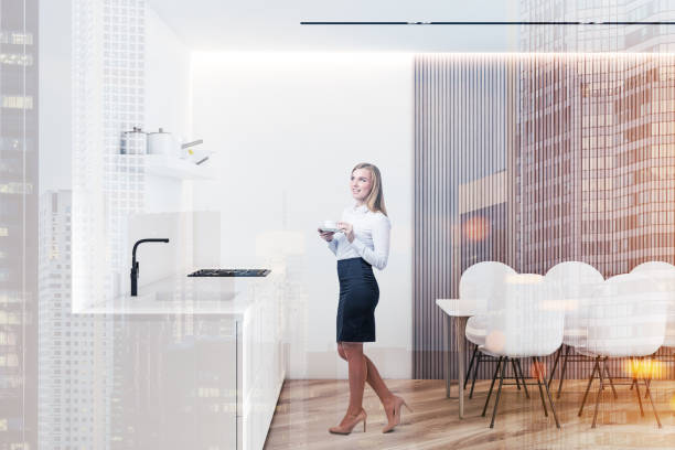 istock Woman in kitchen with countertops and table 1150350717
