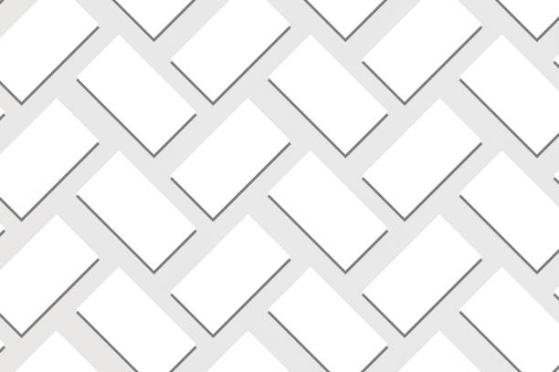 istock Mockup of horizontal business cards stacks arranged in rows at white textured paper background. 1150351452