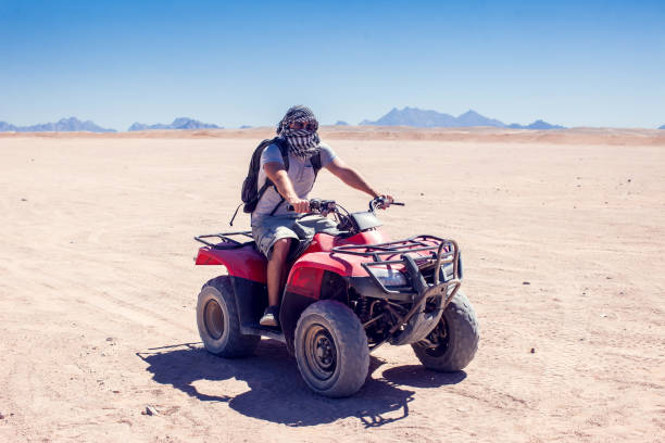 istock A group of quad bikes drive in the desert 1150352603