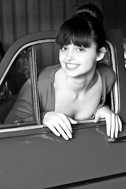 istock beauty young woman with car 115035273