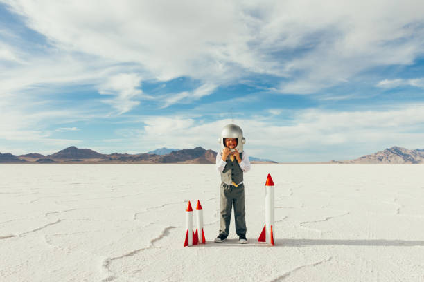 istock Little Boy Businessman with Rockets 1150353709