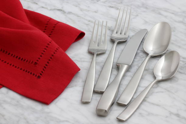 istock silverware and hemstitch napkin on antique carrara marble 1150353906