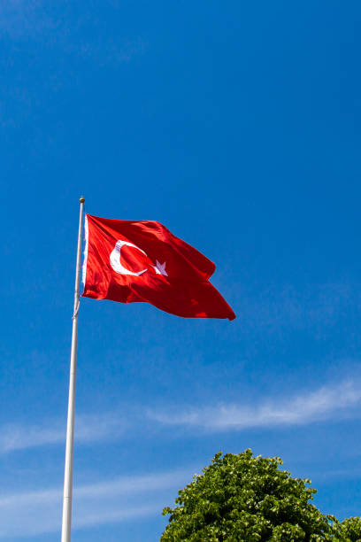 istock Turkish national flag with white star and moon in sky 1150358372