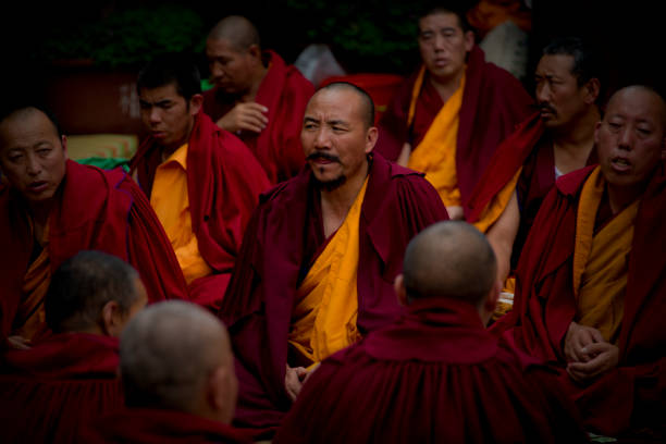 Lhasa, Tibet, 2016-8-6. Gelugpa Monks also known as the Yellow Hat Order worshiping in the Jokhang Temple