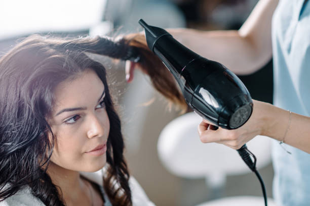 istock Drying hair in hair salon 1150359452