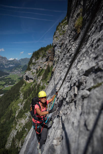 istock Pretty, female climber on a via ferrata 1150363523