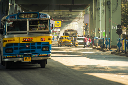 Kolcata, India, January 21, 2018. City life with bus and taxi on the streets of Kolkata, India. Kolkata also known as Calcutta is the capital of the Indian state of West Bengal, India.