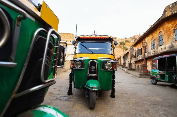 Beautiful view of some auto rickshaw (also known as Tuc Tuc) parked on the streets of Jaipur, Rajasthan, India.