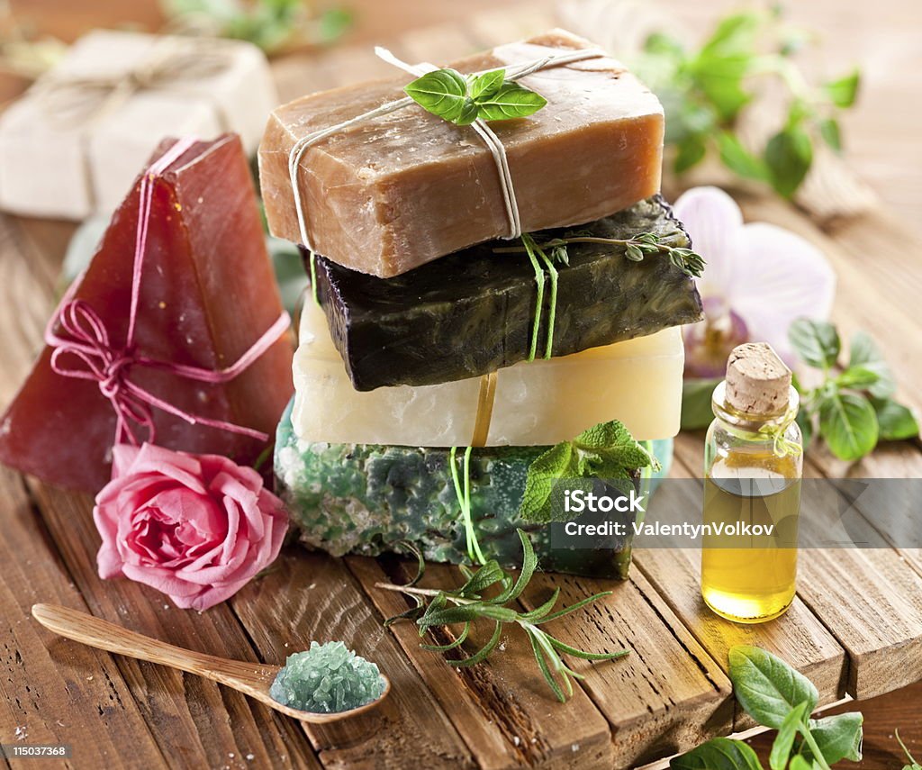 Pieces of natural soap. Piece of natural soap with herbs and flowers. Soap Sud Stock Photo