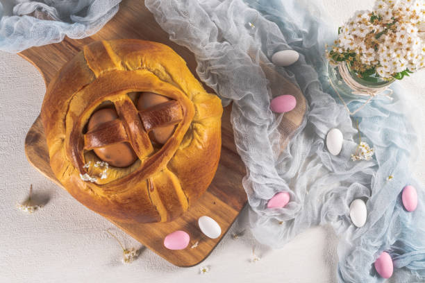 istock Portuguese traditional Easter cake. Folar with eggs on wooden table 1150374827