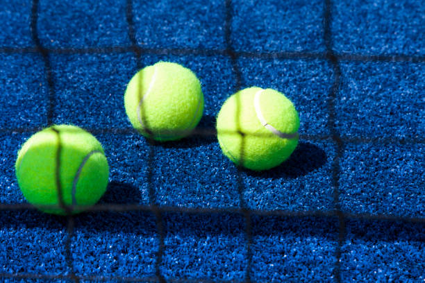 istock Tennis ball with racket on court 1150376042