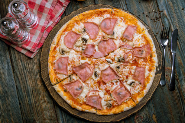 istock Pizza with ham and mushrooms 1150382194