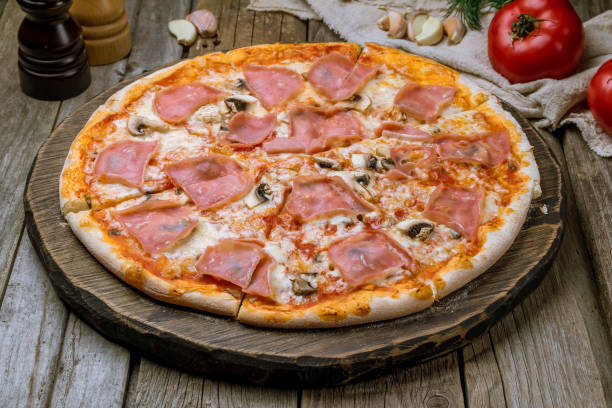istock Pizza with ham and mushrooms 1150382227