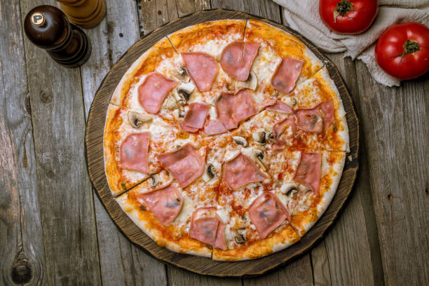 istock Pizza with ham and mushrooms 1150382235